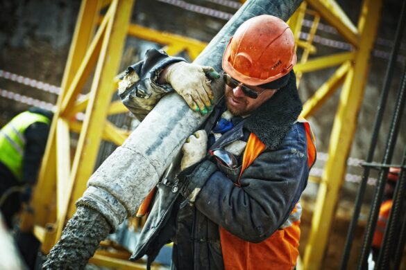 Construction worker carrying materials.