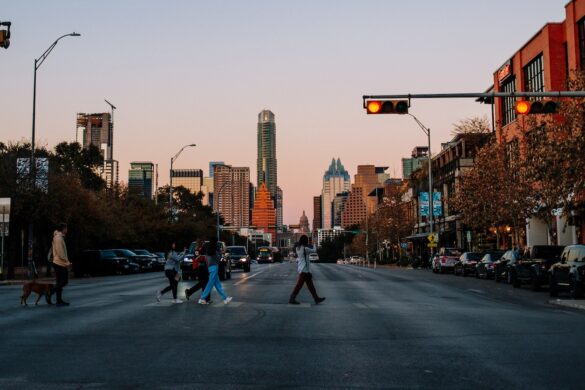 People walking around Austin Texas, taking photos.