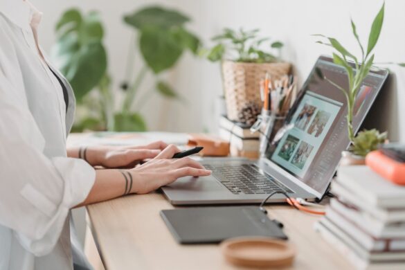 Woman retouching a photo on laptop