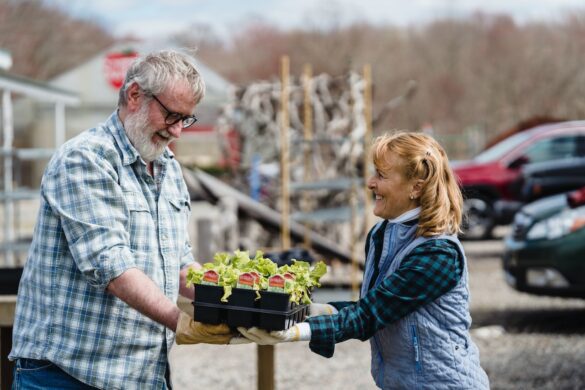 Cheerful man and woman farmers