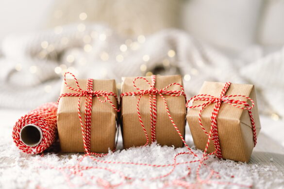Ready Christmas card. Three Christmas gifts and Festive holiday decoration. Gift wrapping