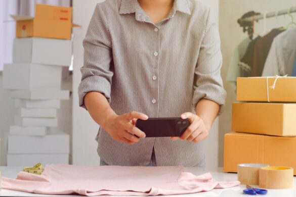 Owner of online seller taking product photos for uploading to website, online shop, young woman hand