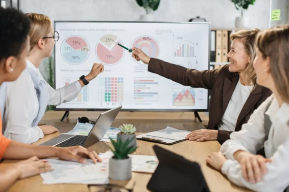 Multi ethnic team of female brokers spending time at office for making strategy