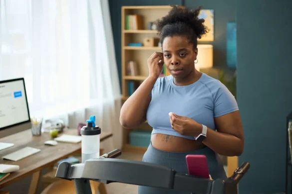 Woman Exercising on Treadmill During Home Workout Session
