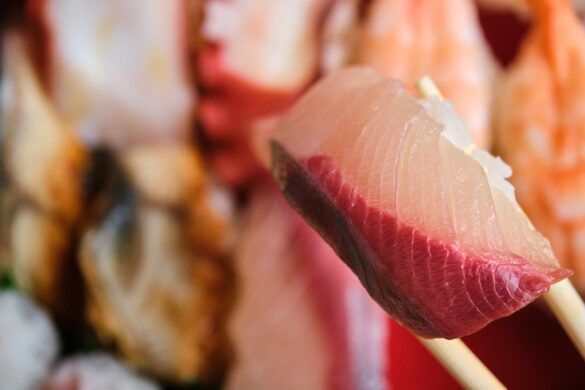 Yellowtail nigiri on a selection of varied Japanese sushi.