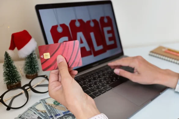 Winter holiday online shopping Woman holding credit card and buying gift on sale due to coronavirus