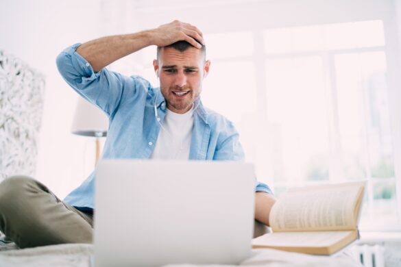 Young male employee troubled by work issue